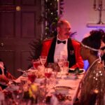 Actors at a dinner table