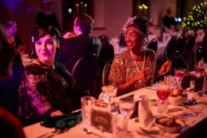 Two actresses at dinner party
