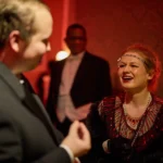 Actor and actress laughing together