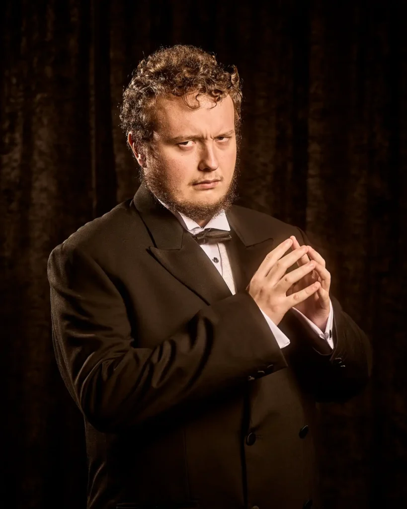 Potrait of actor with hands together