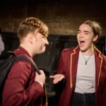 Actress laughing at actor