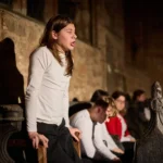 Actor sitting up in chair
