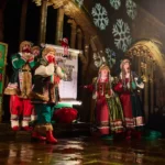 Actor dressed as elves on stage