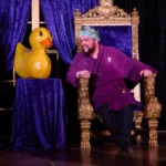 Actor with large inflatable duck
