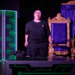 Actress standing infront of desk