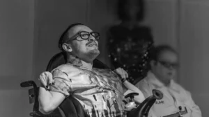 An EGO actor in rehearsals looking up and smiling