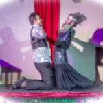 Two actors leaning away from eachother