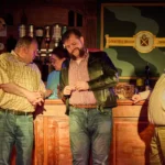 Three actors infront of bar