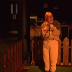 Actor infront of fence