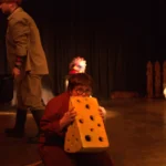 Actor eating prop cheese