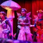 Three actresses dressed as fairies