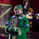 Actor dressed as elf smiling