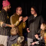 Ensemble of actor discussing