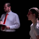 Actor and actress starng into distance