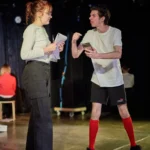 Actor arguing with actress on stage