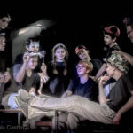 Ensemble of actors dressed as story book charcters