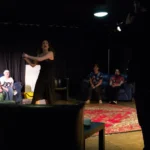 Actress swinging prop gun