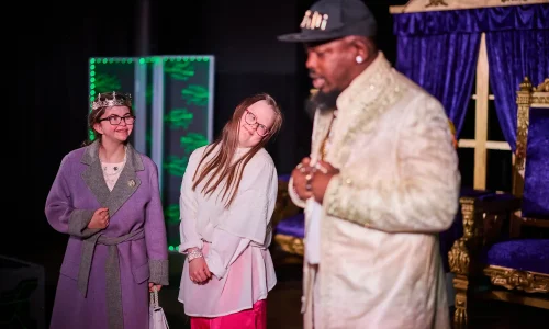 Two actresses fawning for actor